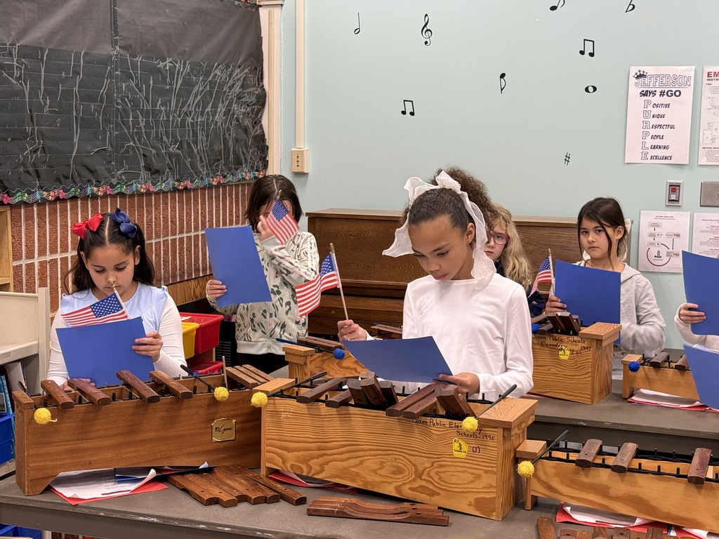 3rd grade students in music class preparing for the Veteran's Day concert
