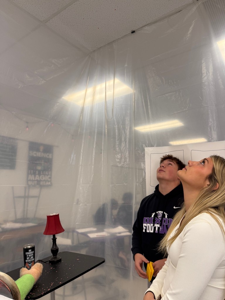 dhs forensic students looking at crime scene