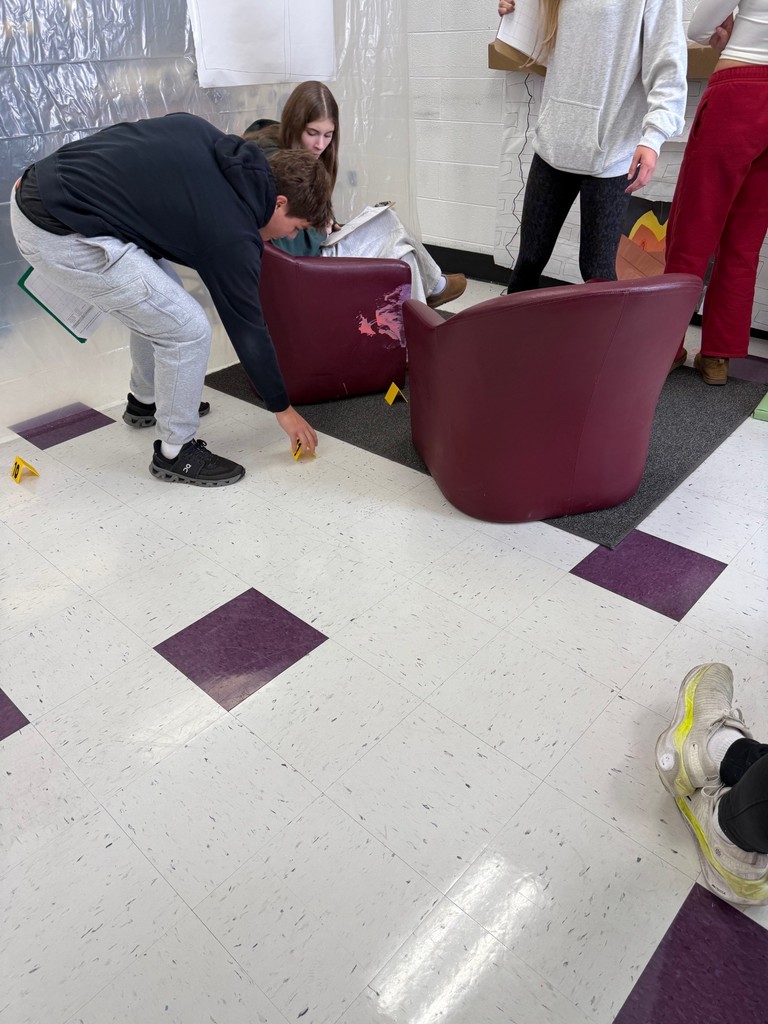 dhs forensic students looking at crime scene