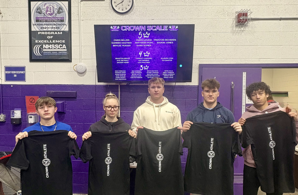 dixon performance students holding shirts