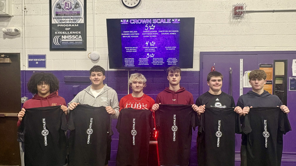 dixon performance students holding shirts