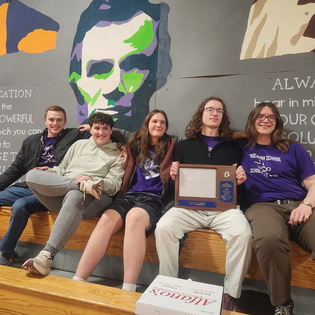 Photo of students with conference champs plaque