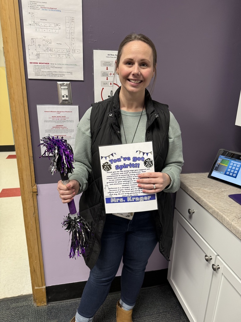 Mrs. Krager with her Spirit Stick and certificate. 