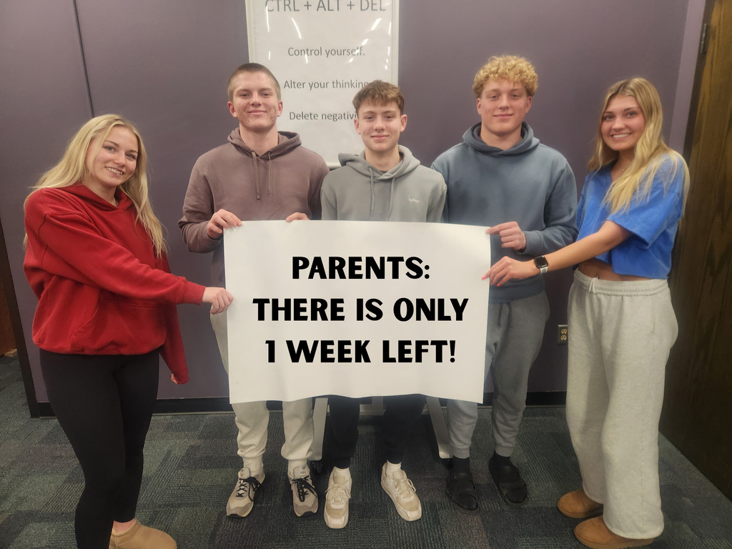 5 essentials appeal with students holding sign