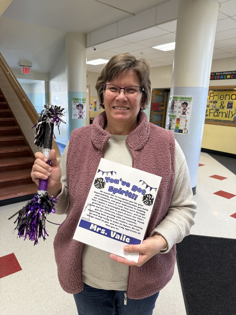 Mrs. Vaile with her spirit stick and certificate