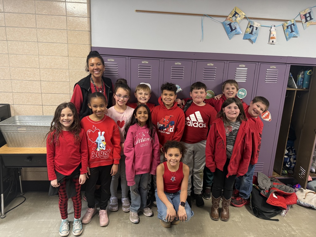 Mrs. Hoyle and her class in red