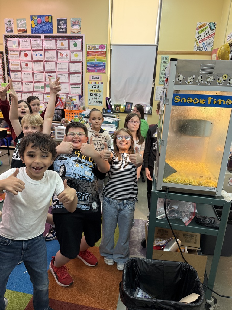 2nd graders enjoying popcorn