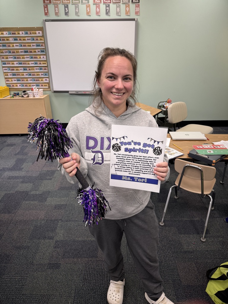 Ms. Tori and her spirit stick and certificate