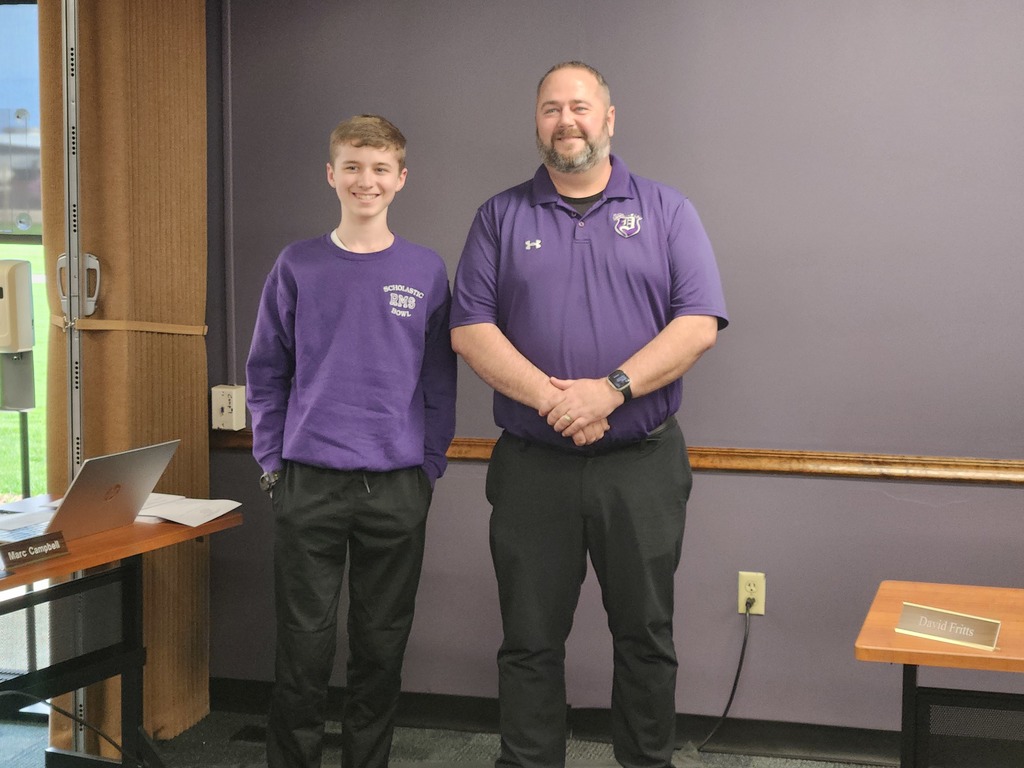 Photo of Principal Magnafici with a student of the month