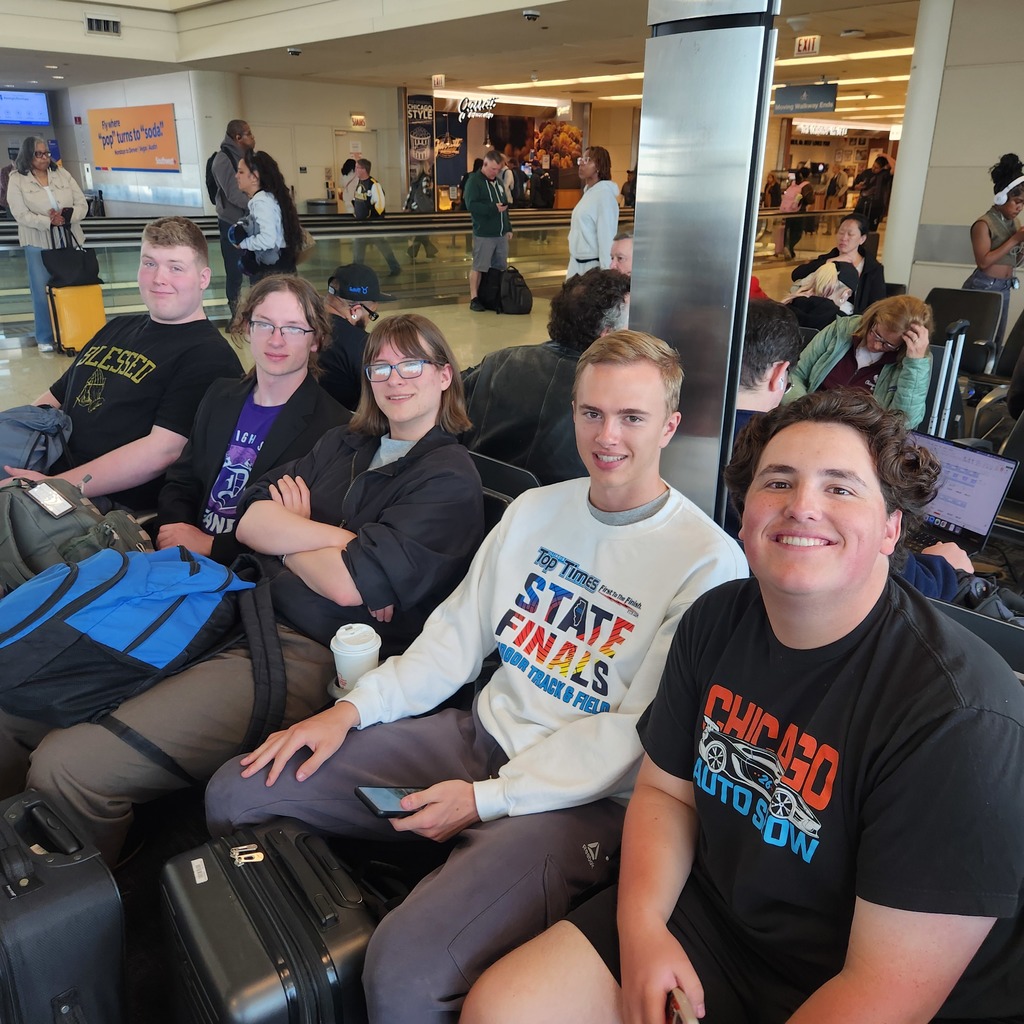 Scholastic Bow team  in the airport lounge