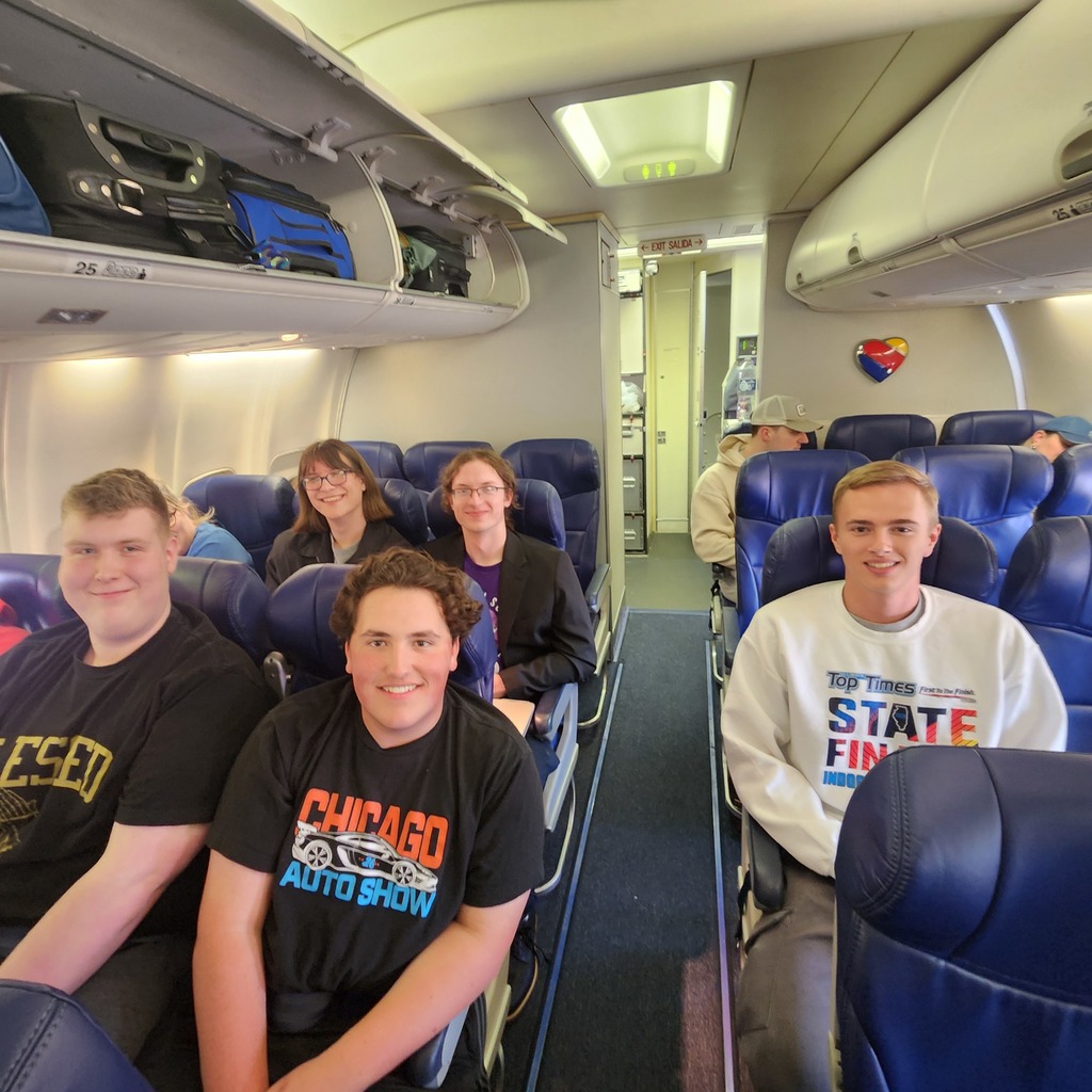 Scholastic Bowl team on board the plane