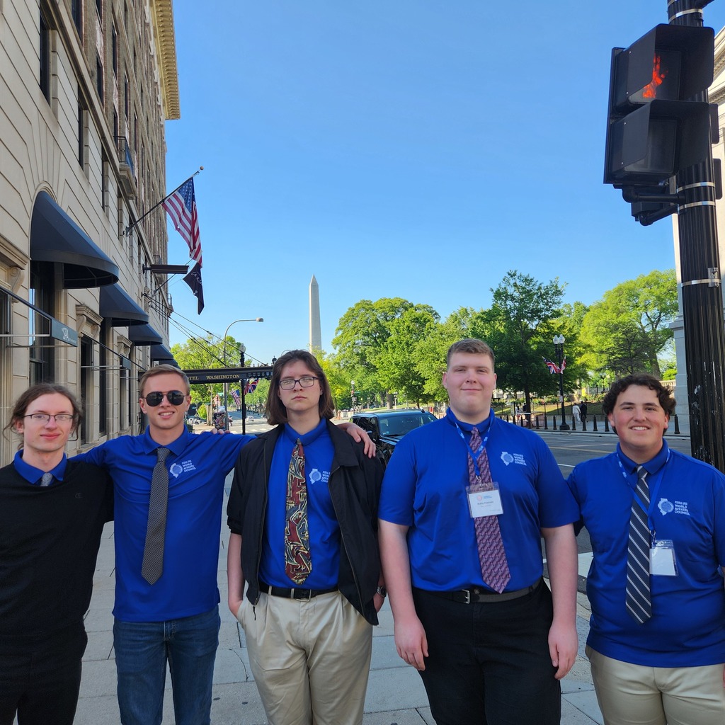 Photo of the 5 Scholastic Bowl students with the Washington Monument in the background