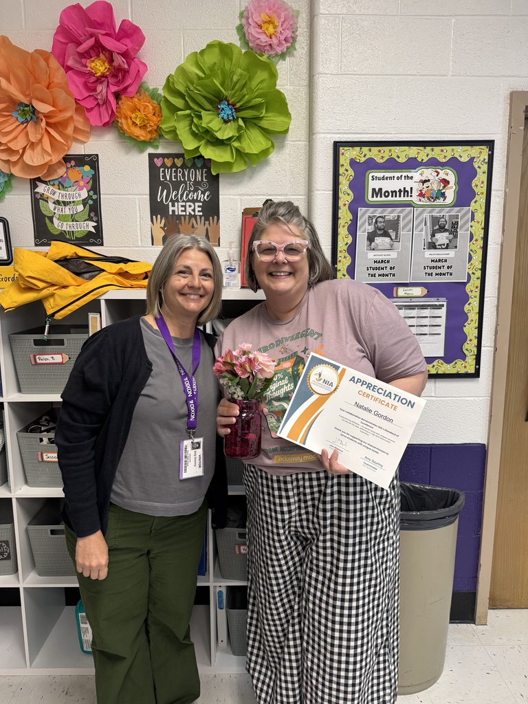 Mrs. Gordon holding her certificate