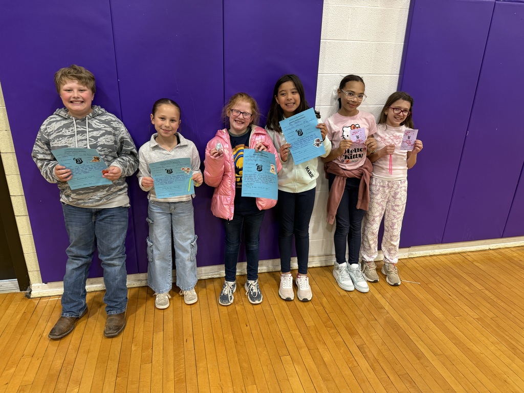 Third grade students with positive office referral certificates and prizes. 