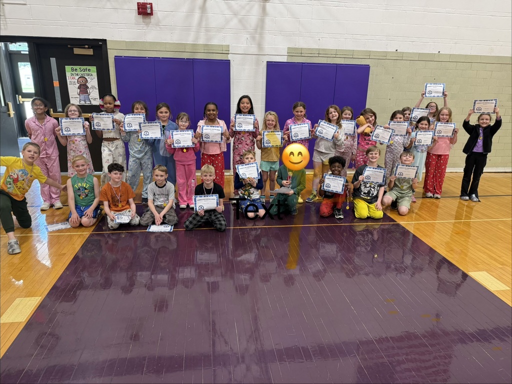 kids with kindness certificates and medals