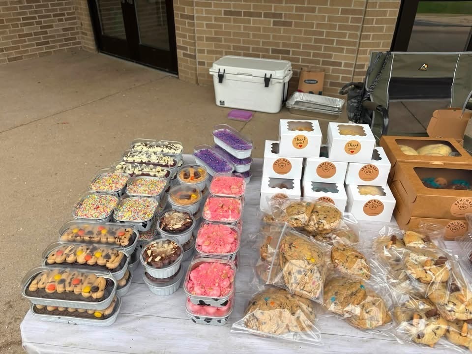 bake sale goods lined up on table top in neat order