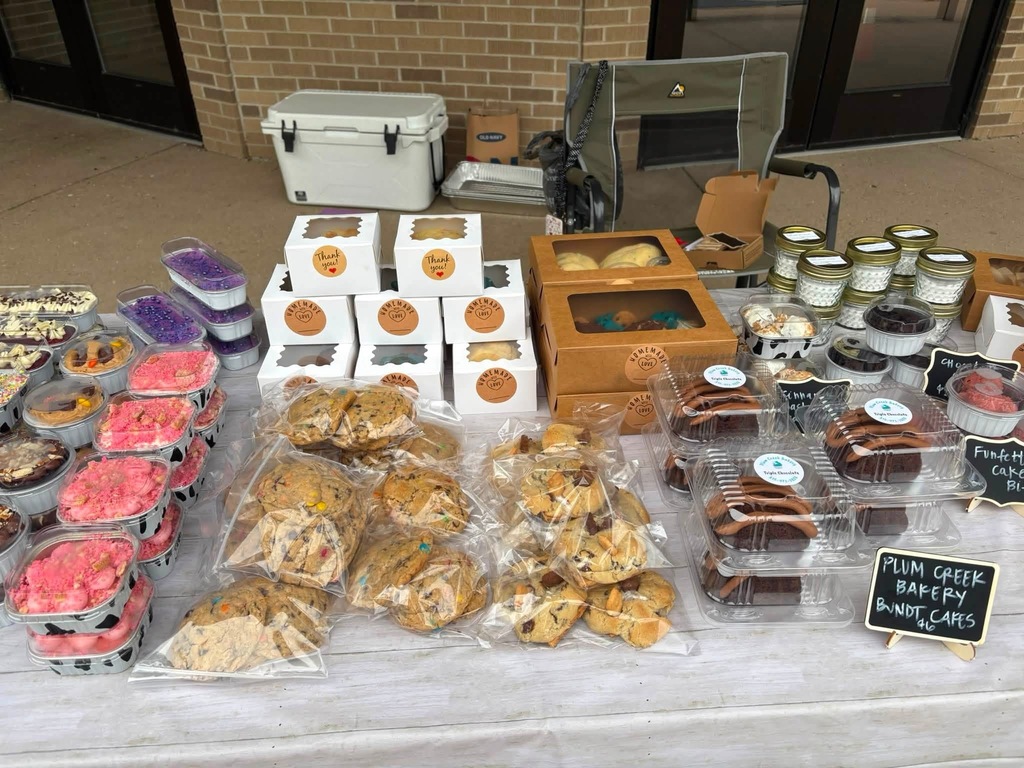bake sale goods lined up on table top in neat order