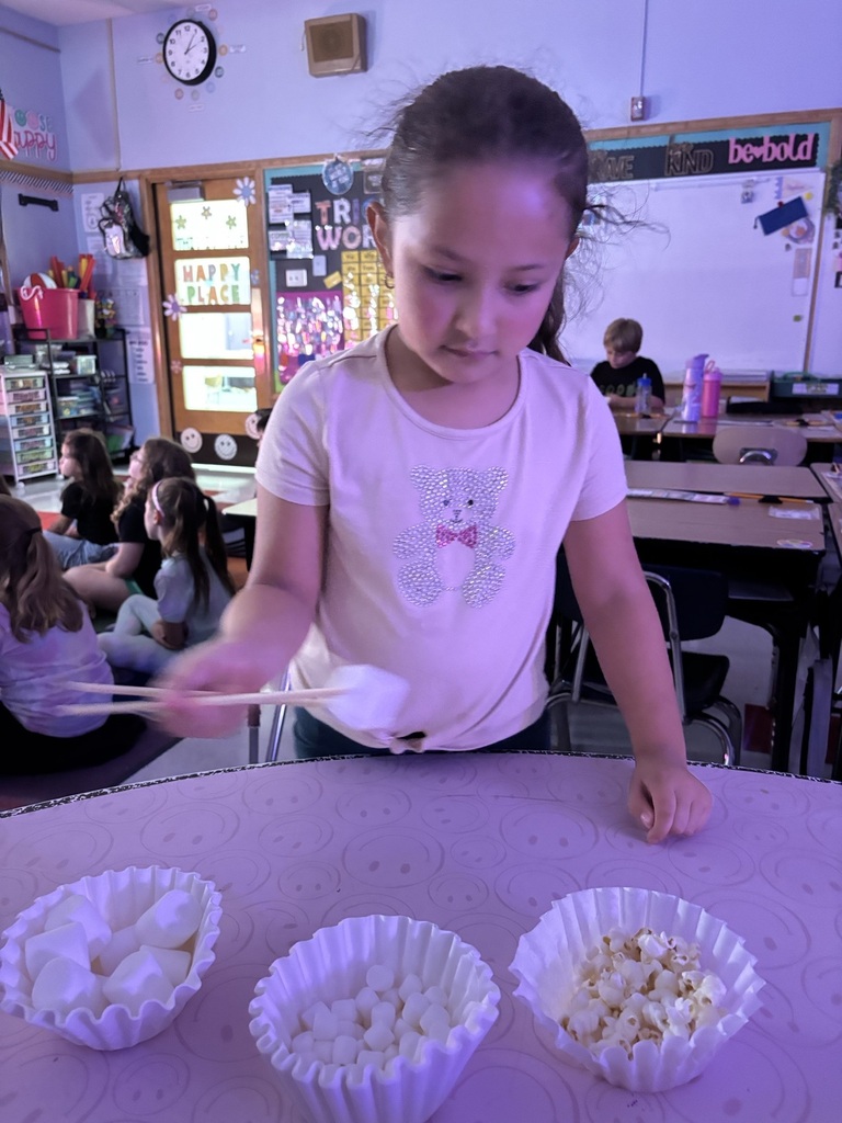 2nd graders using chop sticks 