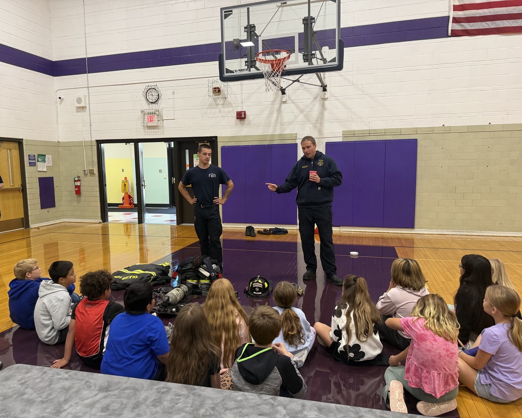 fire fighters giving a lesson on fire safety