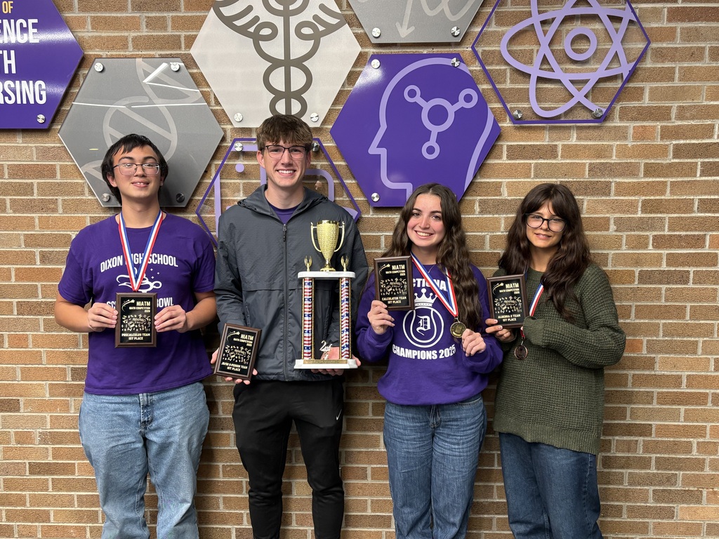 Photo of 4 Math students with medals and trophies