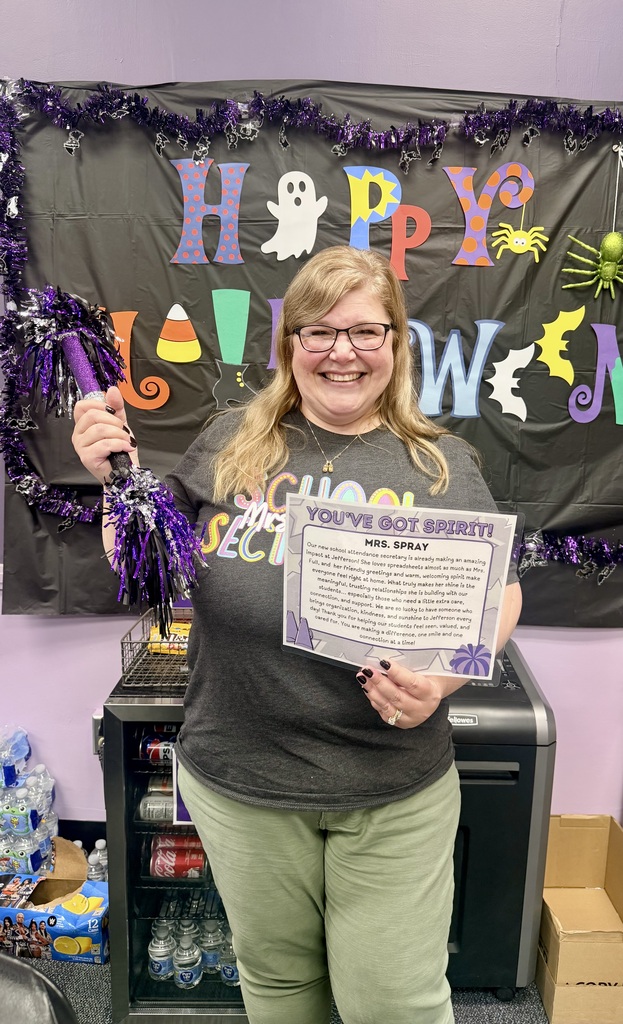 Mrs. Spray with her spirit stick and certificate 