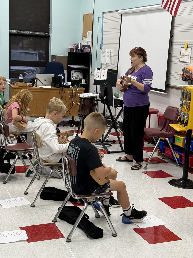Mrs Meeks music class playing ukeleles