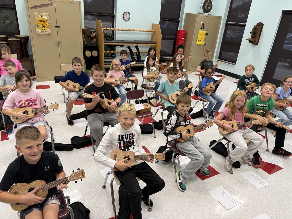 Mrs Meeks music class playing ukeleles