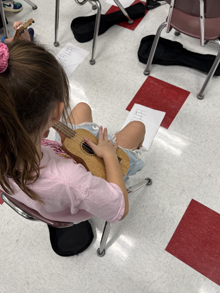Mrs Meeks music class playing ukeleles