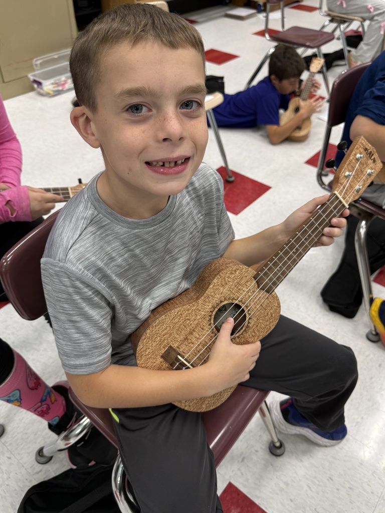 Mrs Meeks music class playing ukeleles