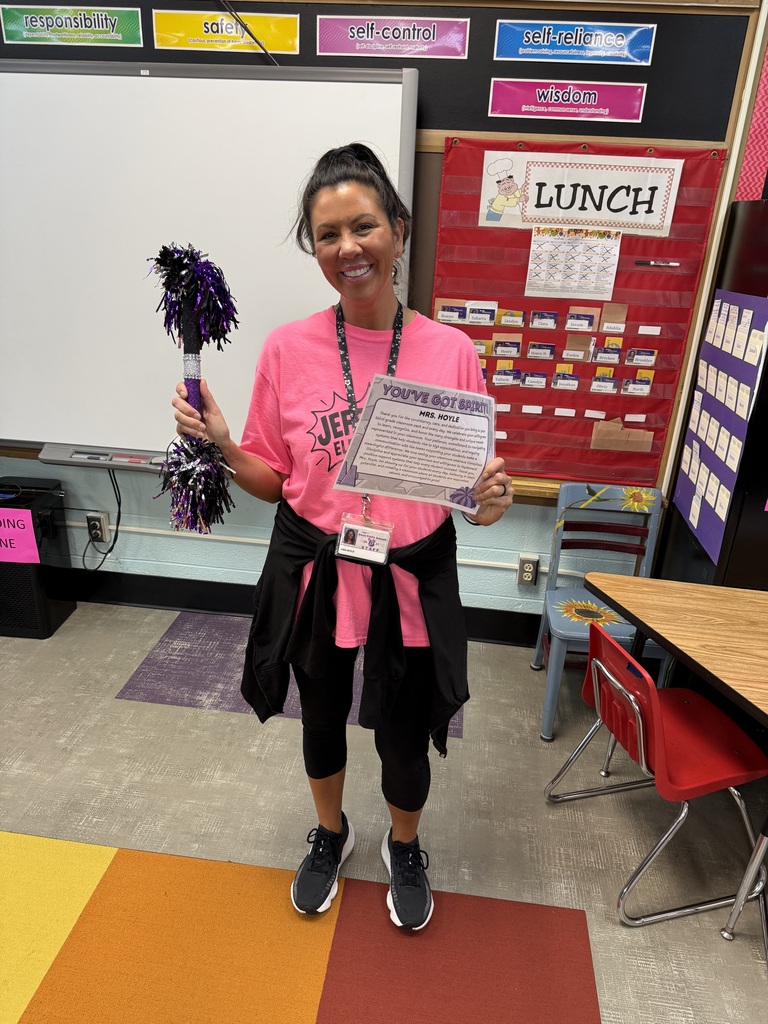 Mrs. Hoyle with her spirit stick and certificate