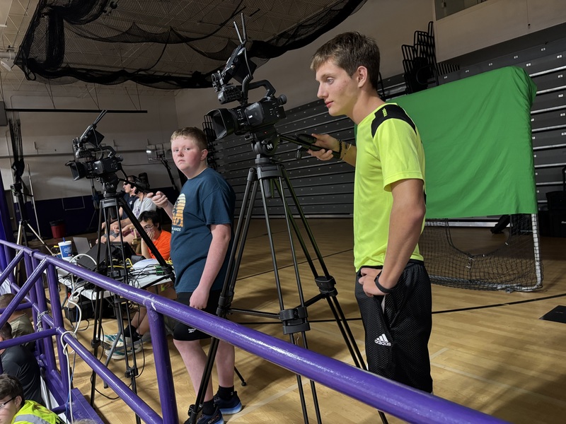 dixon performance athletes holding tshirts