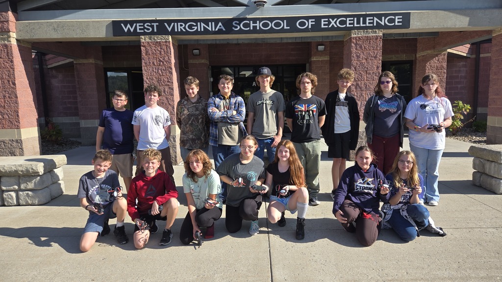 Drone team picture featuring 16 students with 7 females and 9 males