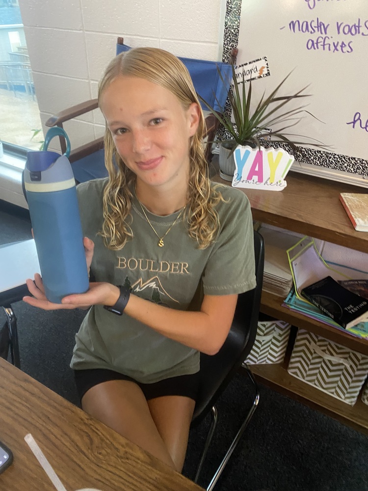 Sophomore Sevyn Russle is smiling because she loves her water bottle.