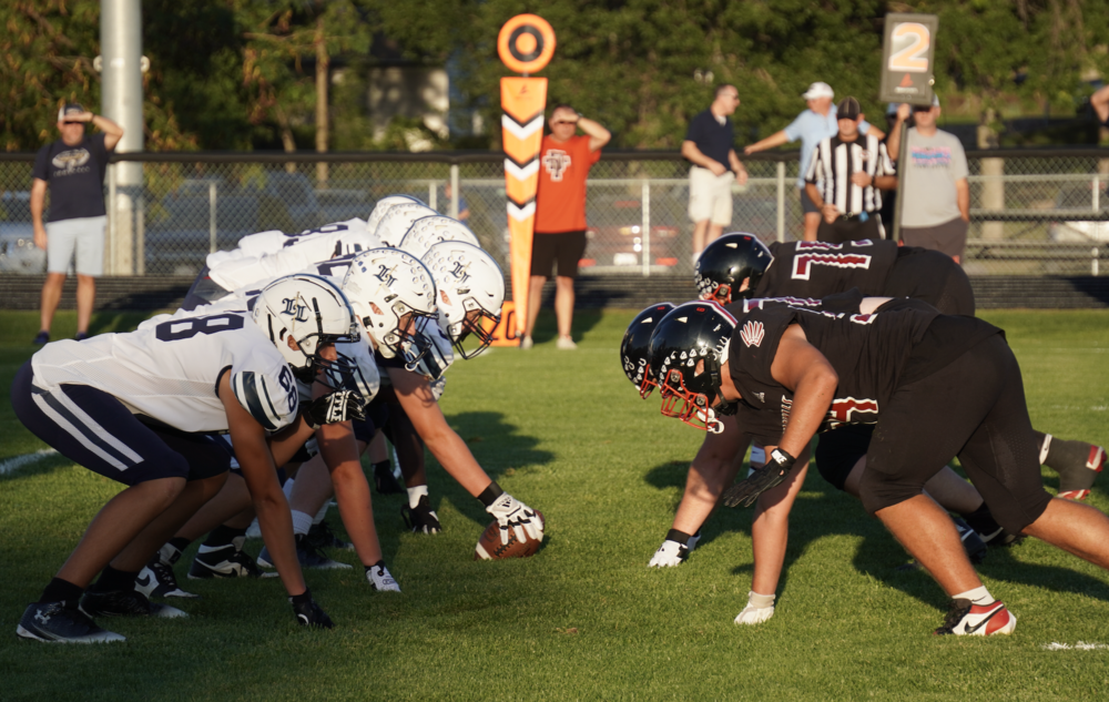 DT meets Lincoln Lutheran at the line.