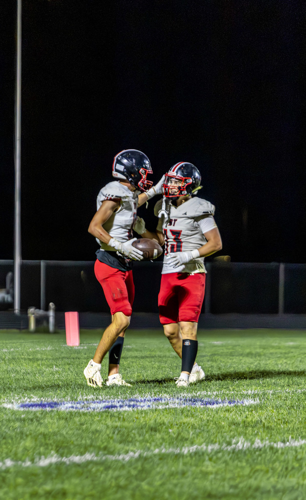 Seniors Jack Poppe and Harrison Winfield celebrate after a touchdown.