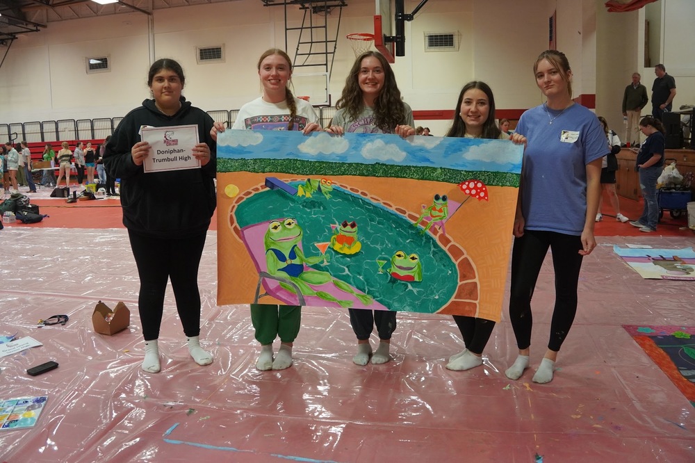 Doniphan-Trumbull students finish their mural at the Mural Day competition.