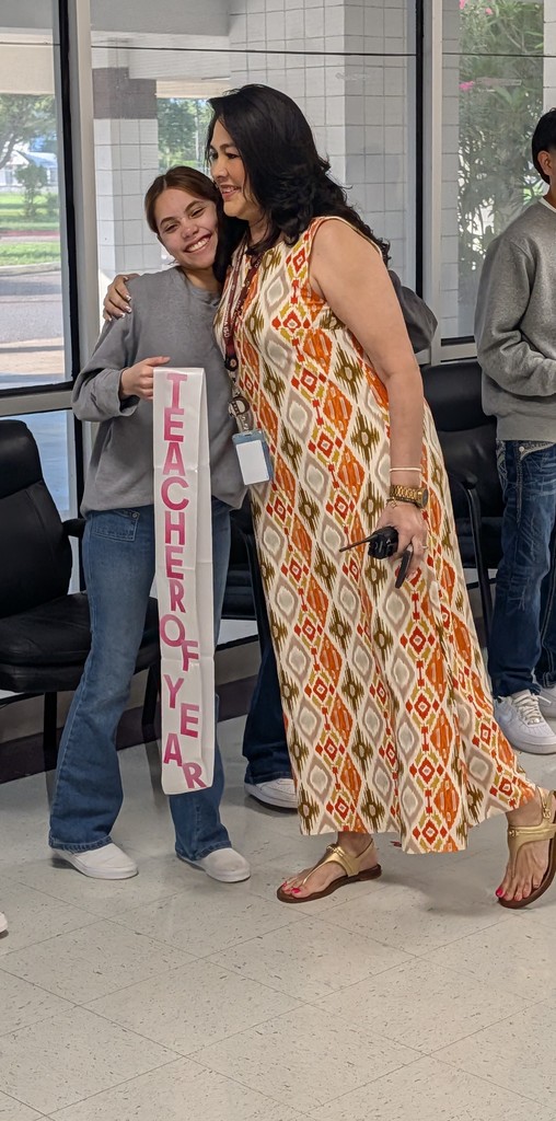 Ms. Zamarron getting a Teacher of the Year sash
