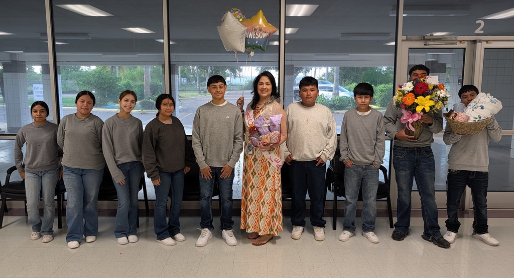 Ms. Zamarron celebrating with a group of students