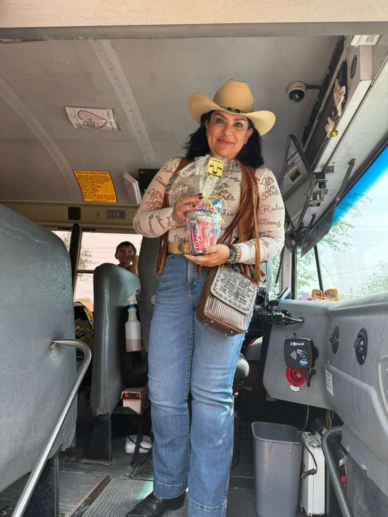 western woman in bus with gift basket