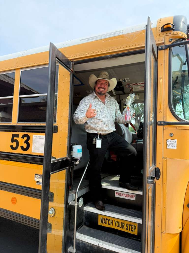 western dressed man in bus 