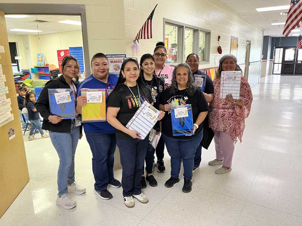 group of women with clipboards