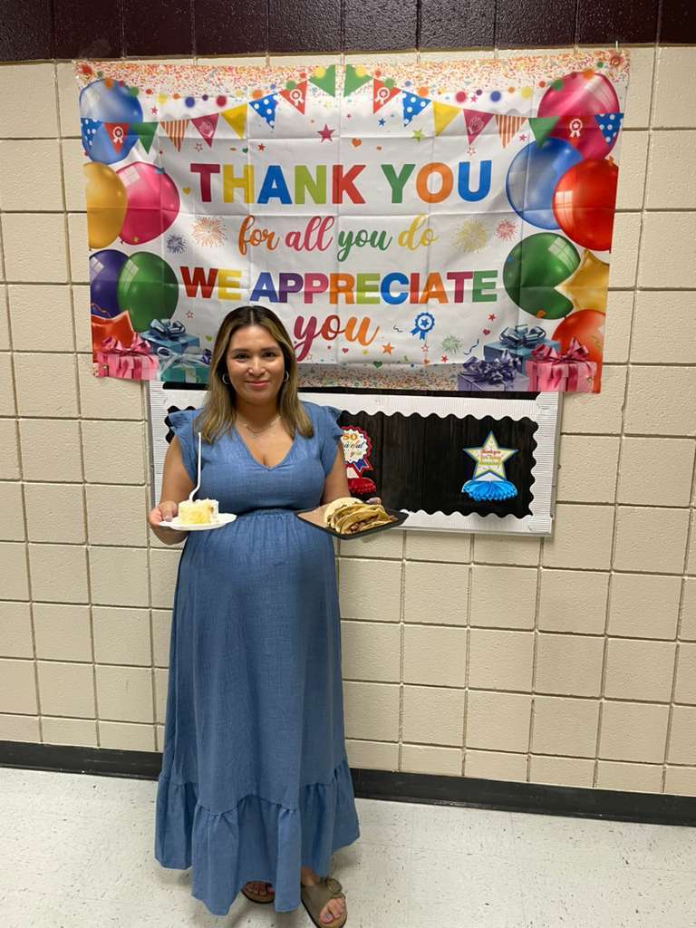 Mrs. Cantu enjoying cake