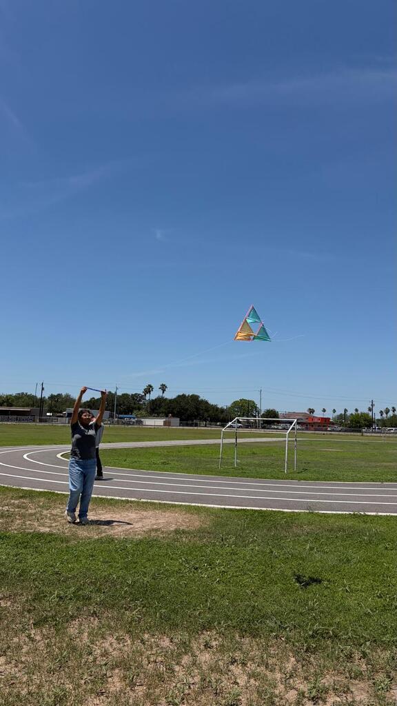 Daep students flying a kite