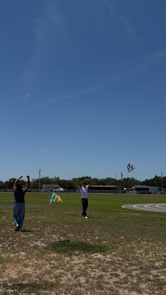 Daep students flying a kite