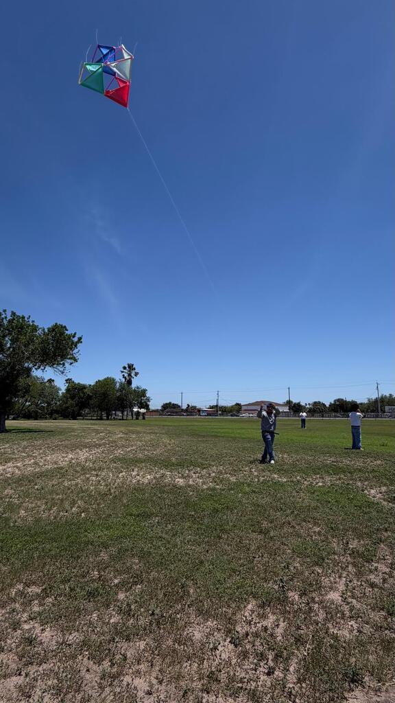 Daep students flying a kite