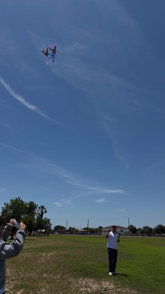 Daep students flying a kite