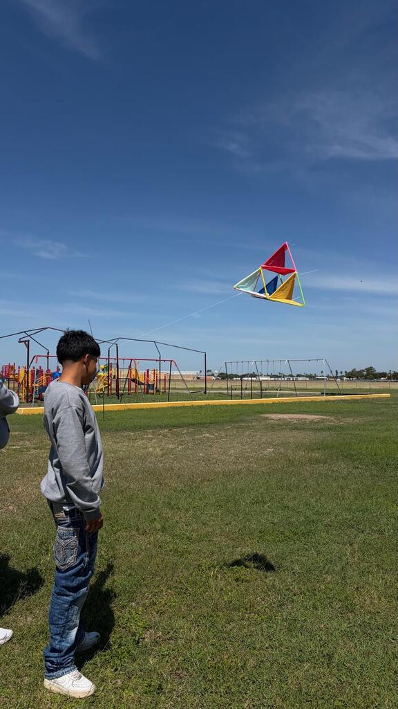 Daep students flying a kite