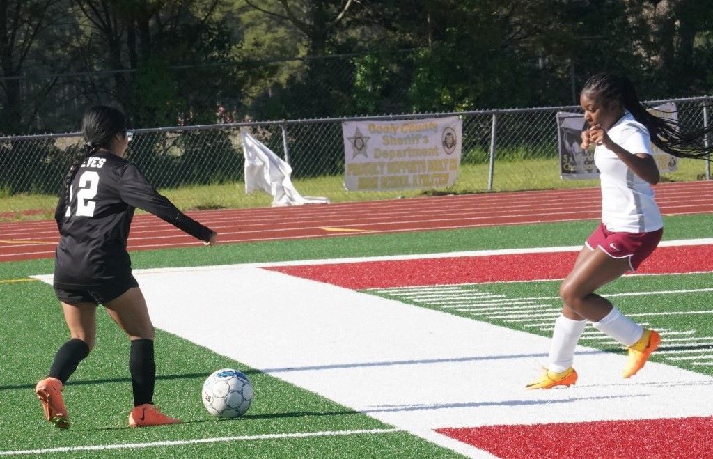 2 Girls Playing Soccer
