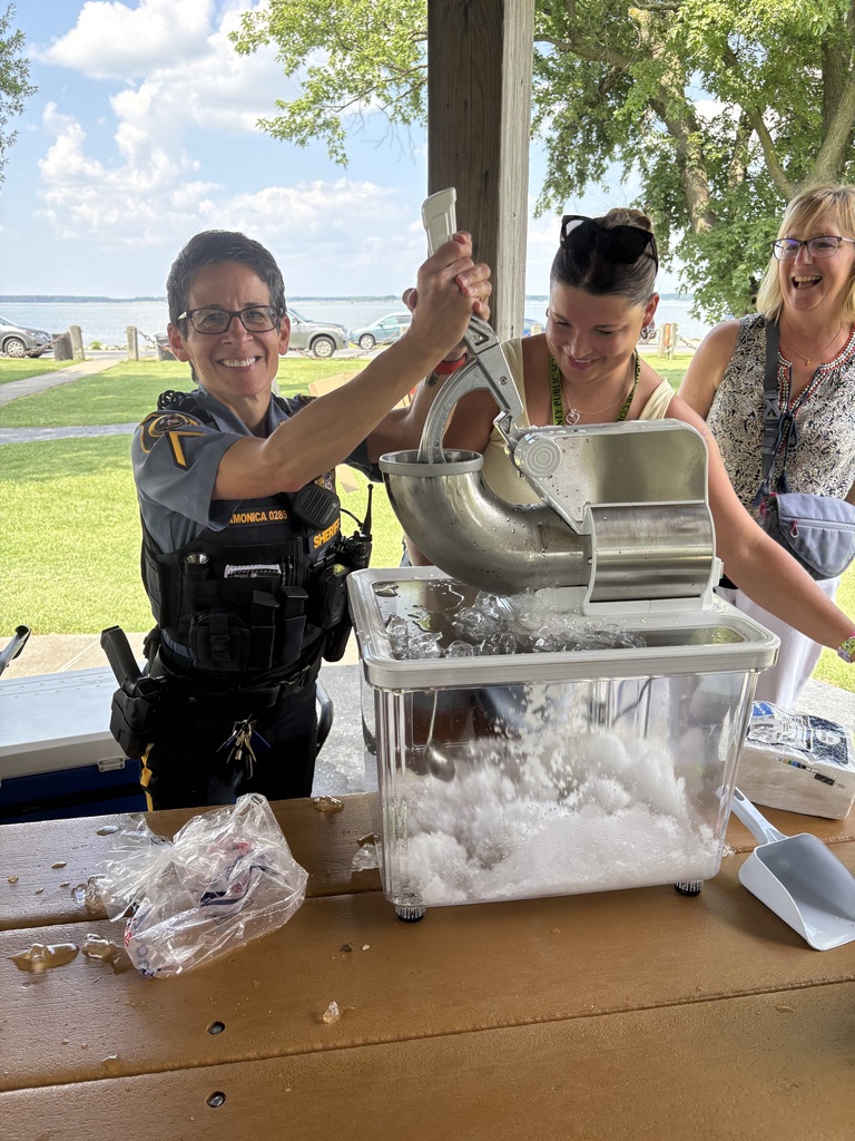 Board members shaving ice for snow cone