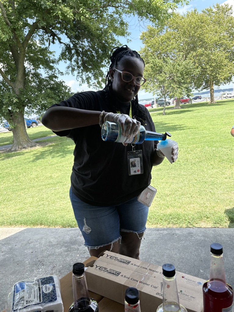 Community school liaison serving snow cone